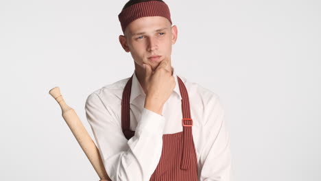 Blond-guy-in-chef-uniform,-thinking