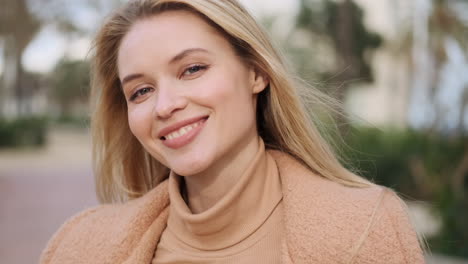 Young-woman-smiling-at-the-camera.
