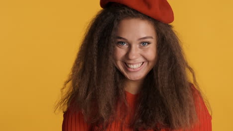Caucasian-curly-haired-woman-wearing-a-beret.