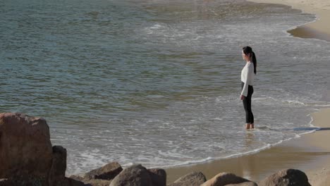 Distant-view-of-asian-woman-on-the-shore