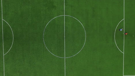 Top-view-of-football-marker-on-green-field