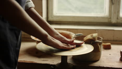 Woman-learning-handicraft-in-pottery