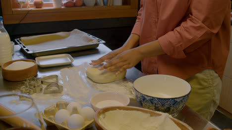 Woman-kneading-dough