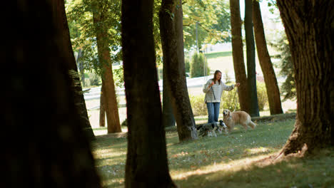 Young-woman-with-pets-at-the-park