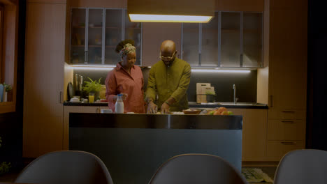 Mature-couple-playing-in-the-kitchen