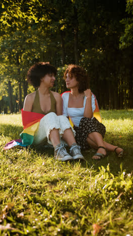 Couple-with-pride-flag-in-the-park