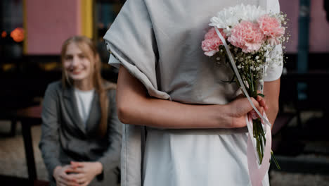 Teenager-giving-flower-bouquet-to-girl