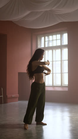 Young-woman-dancing-in-a-classroom