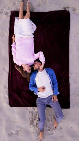 Aerial-view-of-couple-laying-outdoors