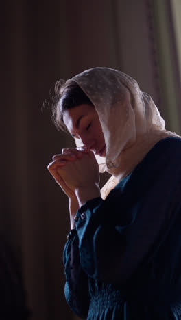 Woman-praying-at-the-church