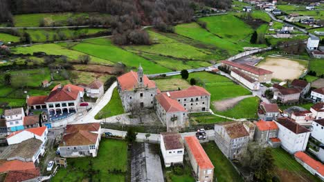 Aerial-pullback-establishes-Santa-Maria-de-Xunqueira-monastery-in-Ourense-during-winter
