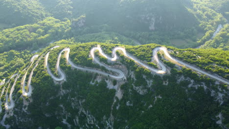 View-of-serpentine-narrow-road-leading-to-Vikos-Gorge-in-Northern-Greece