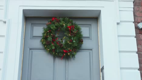 Christmas-wreath-on-door-of-white-entryway-of-typical-Dublin-house