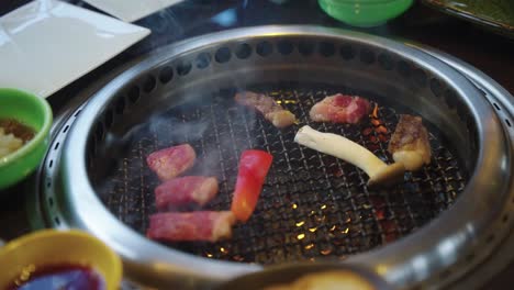 Flames-on-Grill-as-Japanese-Wagyu-is-placed,-close-shot