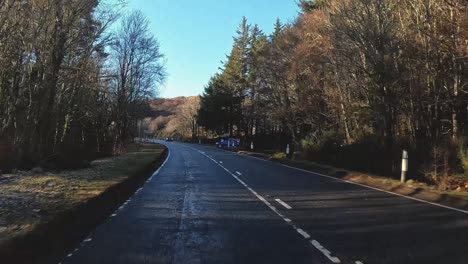 POV-shot-driving-along-a-road-towards-the-Isle-of-Skye-passing-cars