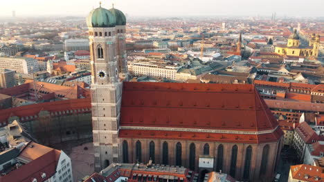 Drone-aerial-landscape-pan-of-Frauenkirche-church-cathedral-city-tower-religion-travel-tourism-Munich-Bavaria-Germany-Europe