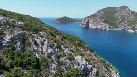 Coastline,-Cliffs-and-Aegean-Sea-in-Porto-Koufo,-Sithonia,-Halkidiki,-Greece---Aerial-4k