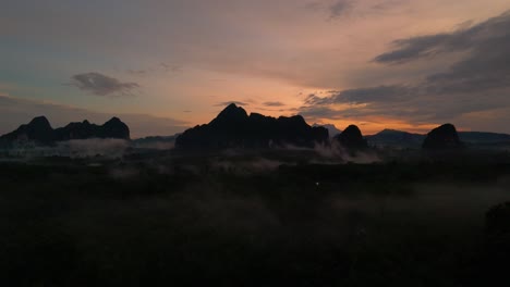 Start-of-a-Beautiful-Day-Early-Morning-Misty-Sunrise-over-Krabi-Limestone-Landscape,-Rising-from-the-Mist