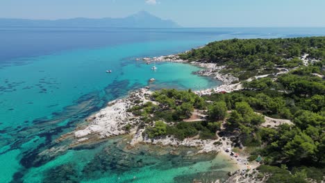 Idyllic-Blue-Bays-and-Beach-Kavourotrypes-in-Halkidiki,-Greece---Aerial-4k-Pedestal