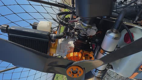 Vertical-format:-Closeup-detail-view-of-paramotor-engine-and-propeller