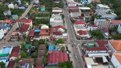 Slow-Descend-Over-Siem-Reap-City-Blocks-Full-Of-Green-Trees-In-Cambodia