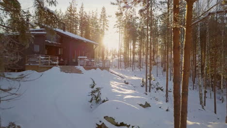 Ski-Resort-Winter-Villa-house-In-Snow-Forest-Against-Sunset-Sunrise