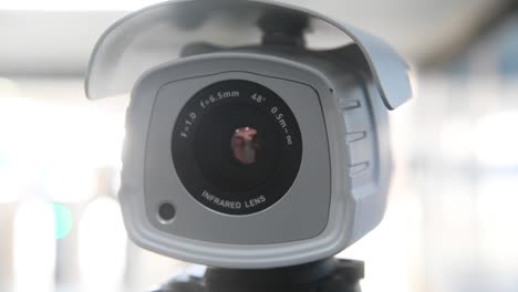 Frontal-establishing-view-of-thermal-infrared-lens-camera,-blurred-background