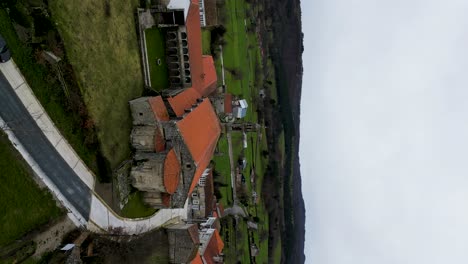 Vertical-aerial-rising-to-back-courtyard-of-Santa-Maria-de-Xunqueira-monastery