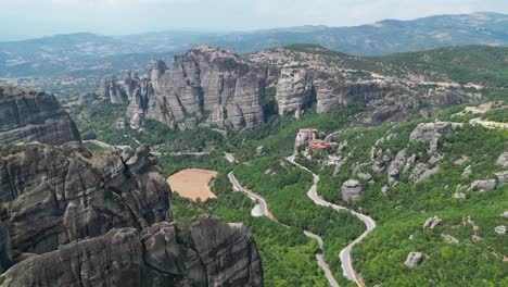 Peneas-Valley,-Scenic-Mountain-Landscape-and-Meteora-Monasteries-in-Greece---Aerial-4k