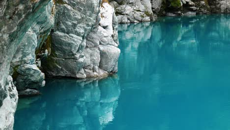 Nature's-Mirror:-Rocks-reflecting-in-the-serene-waters-of-Hokitika-Gorge