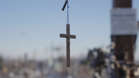 Close-up-of-beautiful-detailed-frozen-wooden-cross-of-crucified-Jesus-Christ,-outside-in-the-forest-on-a-winter-day-in-Lithuania