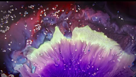 Vivid-purple-ink-explosion-with-glitter-in-water,-creating-an-abstract-bloom-effect