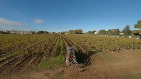 Vineyard-tractor-at-work-in-Baillargues,-France