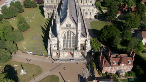Tilting-drone-shot-of-Winchester-Cathedral-captured-in-Summer-in-Hampshire,-UK