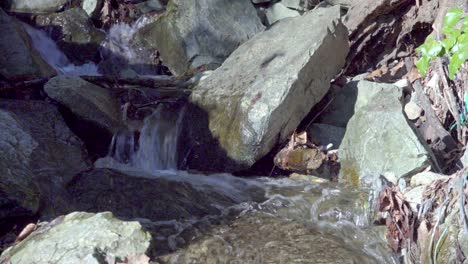 A-natural-stream-finds-its-way-over-a-rocky-surface