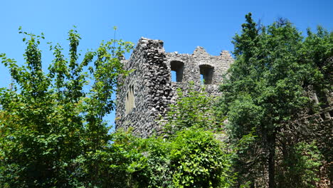 Pan-right-low-angle-shot-of-Badenweiler-castle-ruin-in-sunny-day,-Germany