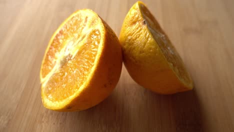 Fresh-sliced-orange-fruit-texture-on-rotating-background