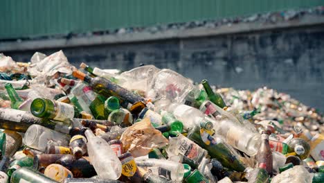 close-up-of-a-mountain-of-glass-bottles-at-a-recycling-center