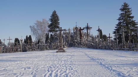 Beautiful-landscape-of-Cross-Hills-in-Lithuania,-in-freezing-winter-weather-with-snow-all-over-the-religious-place