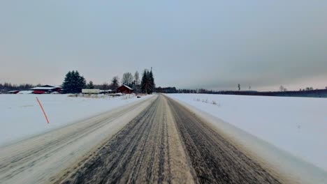 Controlled-winter-driving-POV,-rural-Northern-climate-hazardous-weather