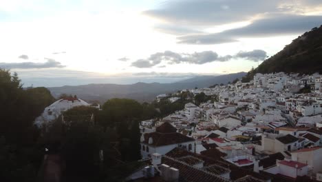 Beautiful-sunset-and-magical-Mijas-city-in-Spain,-aerial-view