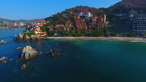 A-beautiful-home-sits-on-a-rocky-point-in-a-picture-perfect-Mexican-town-along-the-coast-of-the-calm-water-bay-in-Zihuatanejo