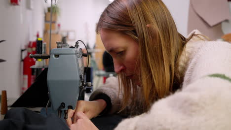 Slow-and-sustainable-female-fashion-designer-maker-using-a-sewing-machine