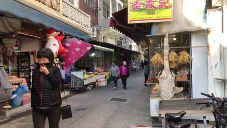 Tourists-from-around-the-world-visit-the-market-streets-in-Tai-O,-Hong-Kong