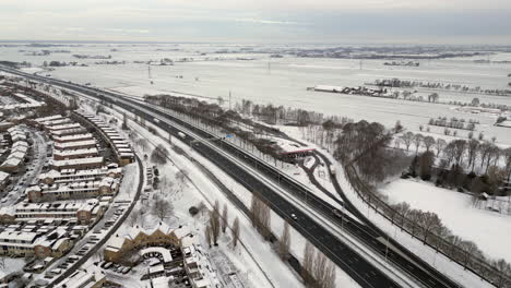 Aerial-View-Snow-landscape-and-highway-A1-at-Amersfoort,-The-Netherlands