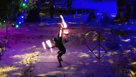 Thai-performers-entertaining-Guests-with-a-fire-show-at-a-beach-bar