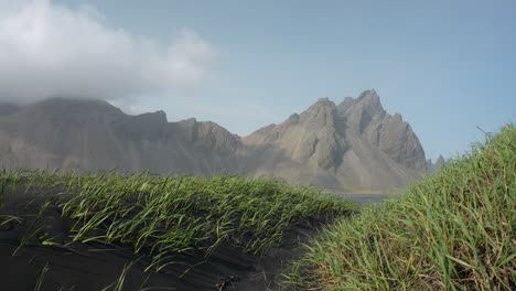 Mount-Vestrahorn-on-the-coast-of-Iceland-on-a-sunny,-breezy-day