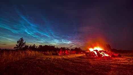 Time-lapse-shot-of-people-celebrating-next-to-a-big-camp-fire-in-the-fields