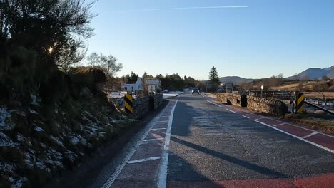 POV-shot-of-a-car-giving-way-to-oncoming-vehicles-in-the-Scottish-highlands