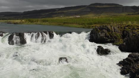 A-small-waterfall-in-a-rocky-river-section-somewhere-in-the-majestic-Icelandic-countryside